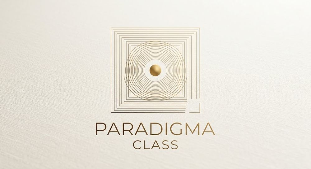 Logo PARADIGMA CLASS emas di atas kertas krem